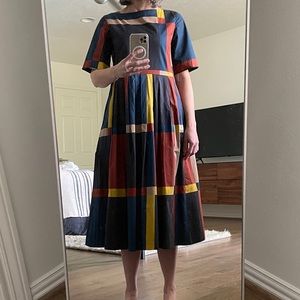 Toast UK cotton midi dress with pleated skirt in blue/rust/yellow pattern